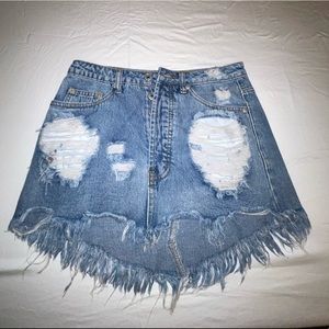 distressed medium wash jean skirt with fraying
